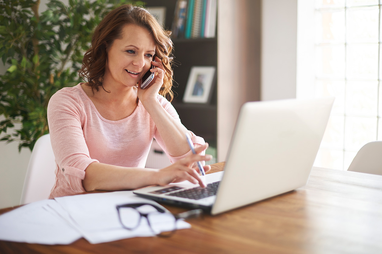 woman on laptop in her home office